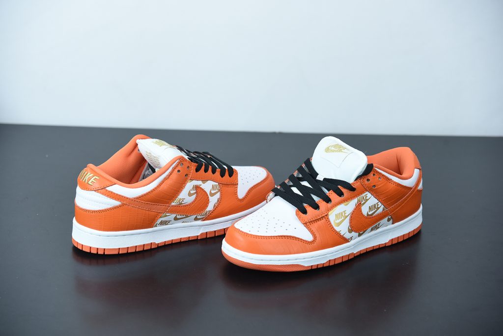 orange and white dunks low gs